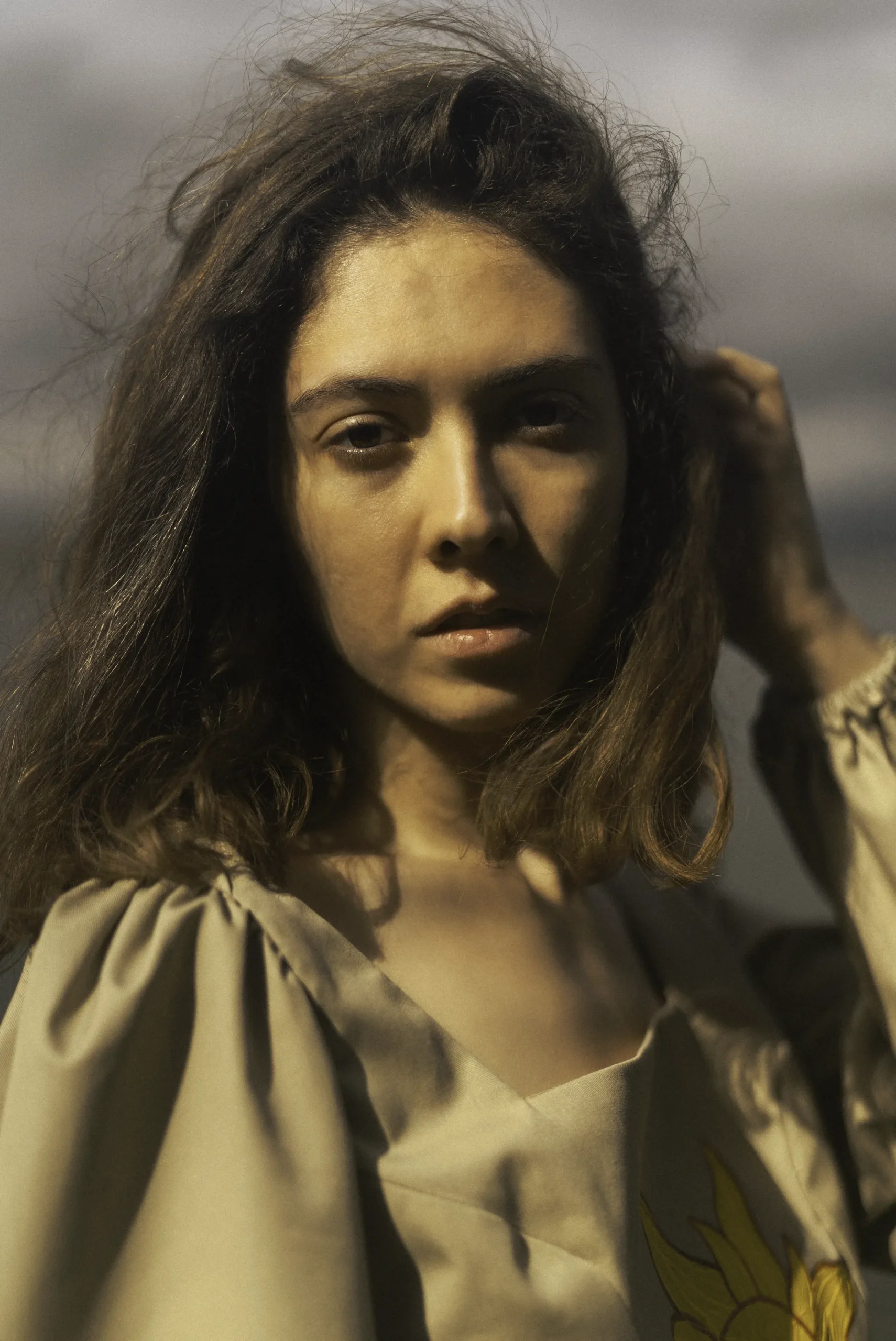 A striking portrait from a fashion collection shoot, where colors were meticulously crafted in pre-production using mood boards, resulting in a highly unique, painting-like photograph with a captivating artistic flair.